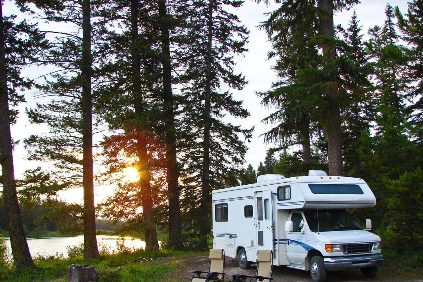 Motorhome parked at a wooded campsite